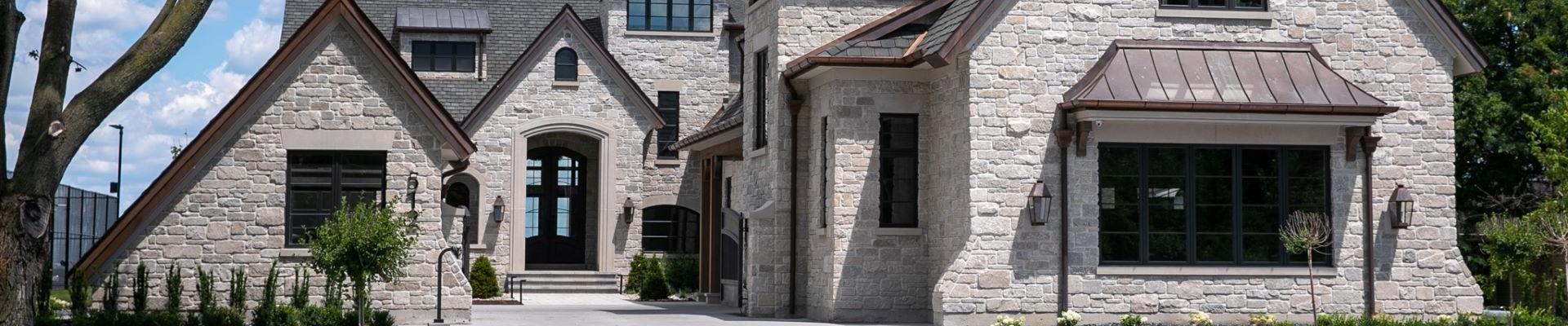 Exterior of home with limestone and brick finish