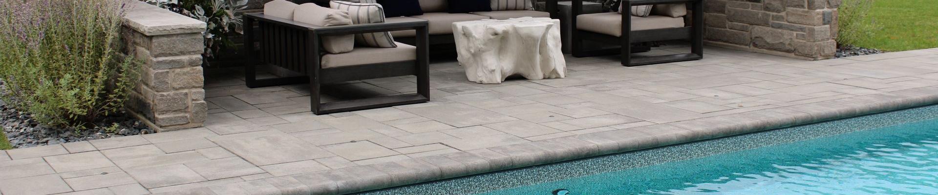 Pool with stone edging and patio